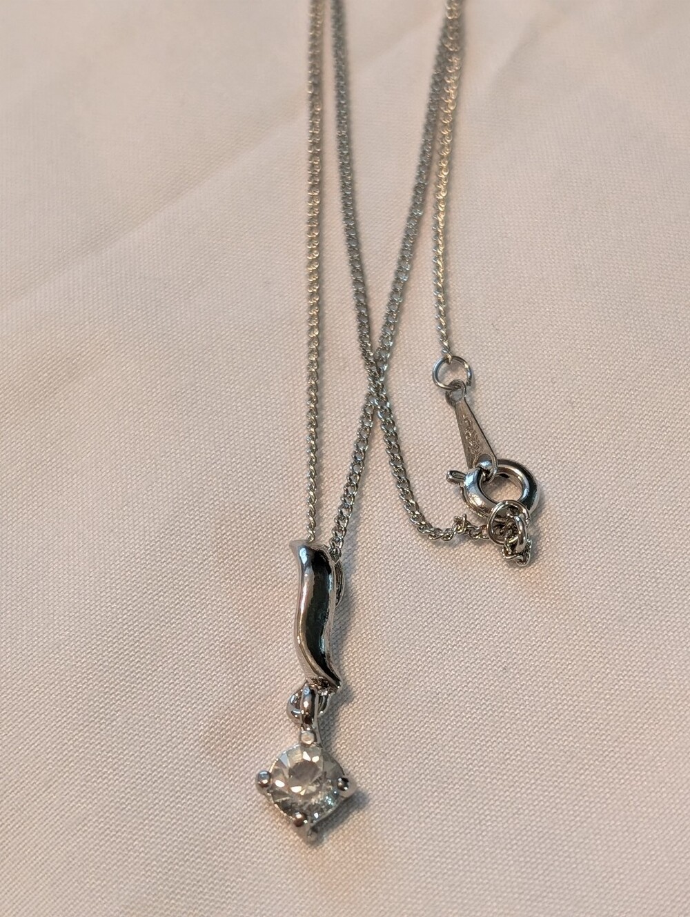 Sterling Silver Pendant Necklace with Pale Blue Stone. 9.5 Inches Long.